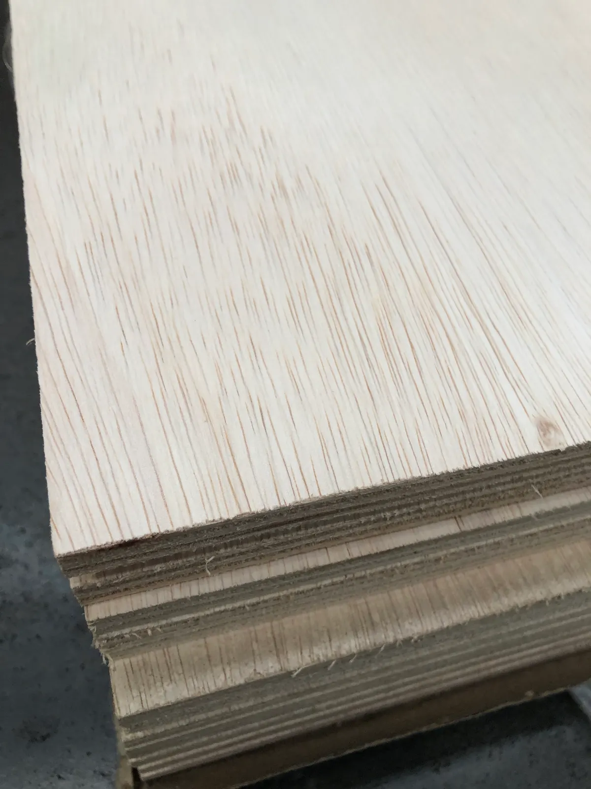 Stack of lightweight falcata plywood sheets showing face and layered edges - PlyMatrix NZ