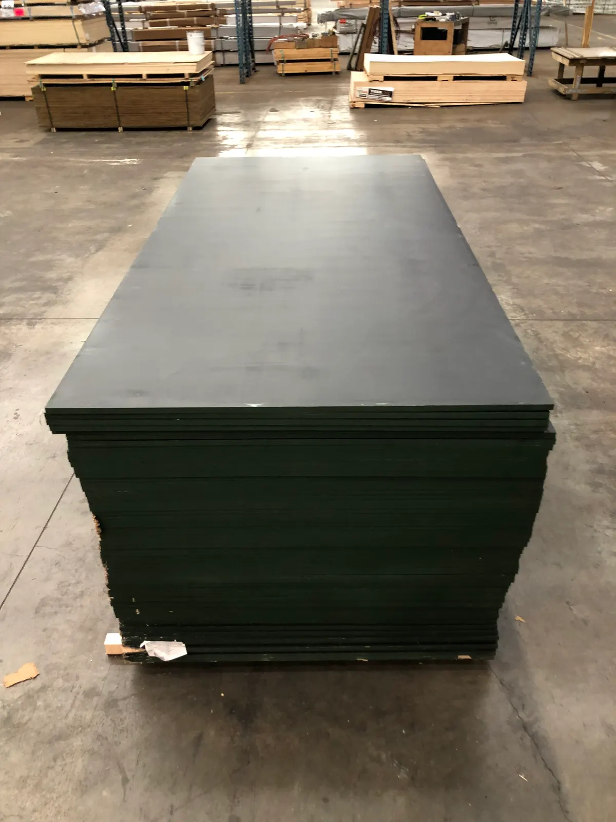 Stack of 17mm black film-faced formply sheets - PlyMatrix NZ