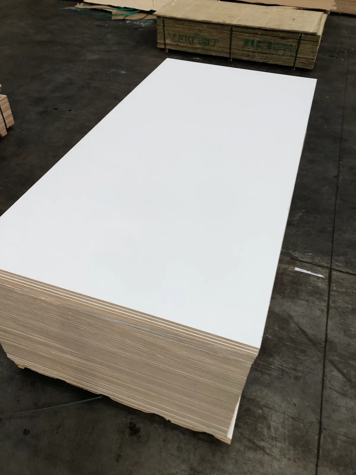 White melamine-faced plywood sheets with poplar core edge visible - PlyMatrix NZ