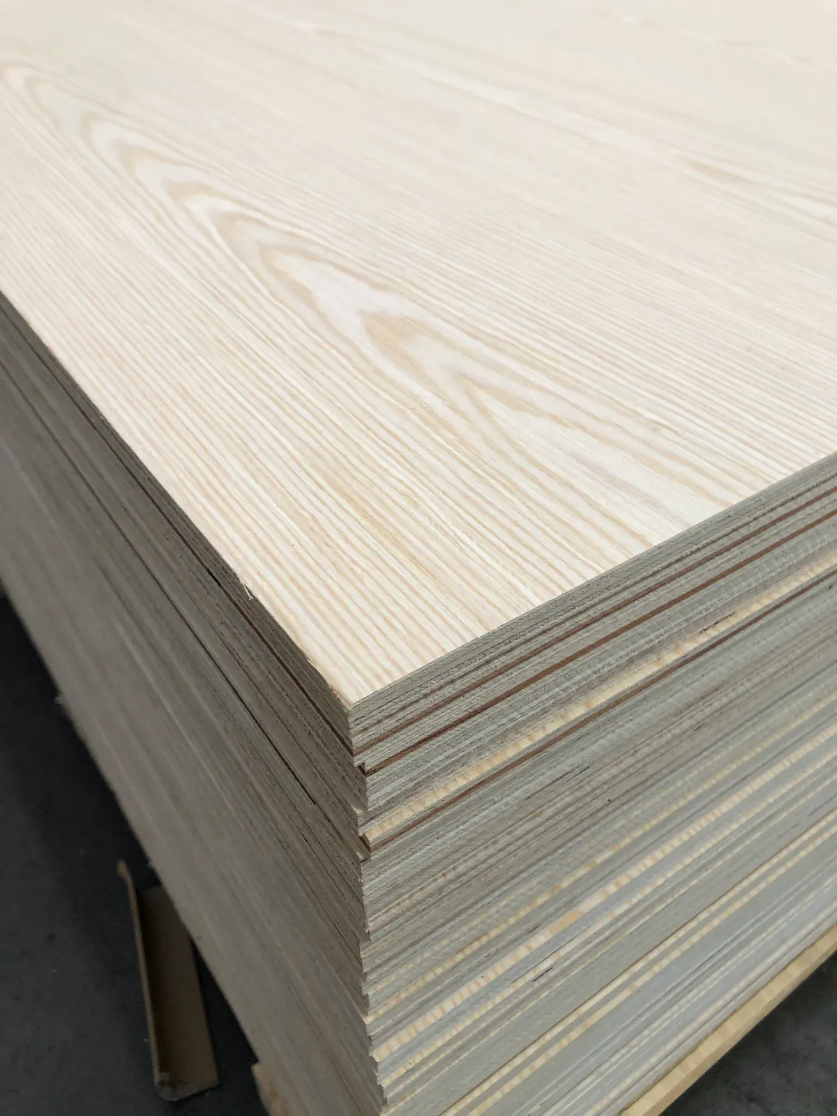 Stack of engineered white oak plywood sheets showing oak grain face - PlyMatrix NZ